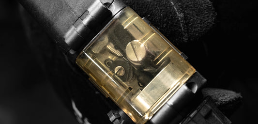 Close-up of the UNIMIG U11221 push-pull gun's wire-feed mechanism through its transparent protective housing.