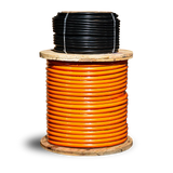 UNIMIG MEGAFLEX welding cable shown as orange cable on a wooden reel with a black coil above