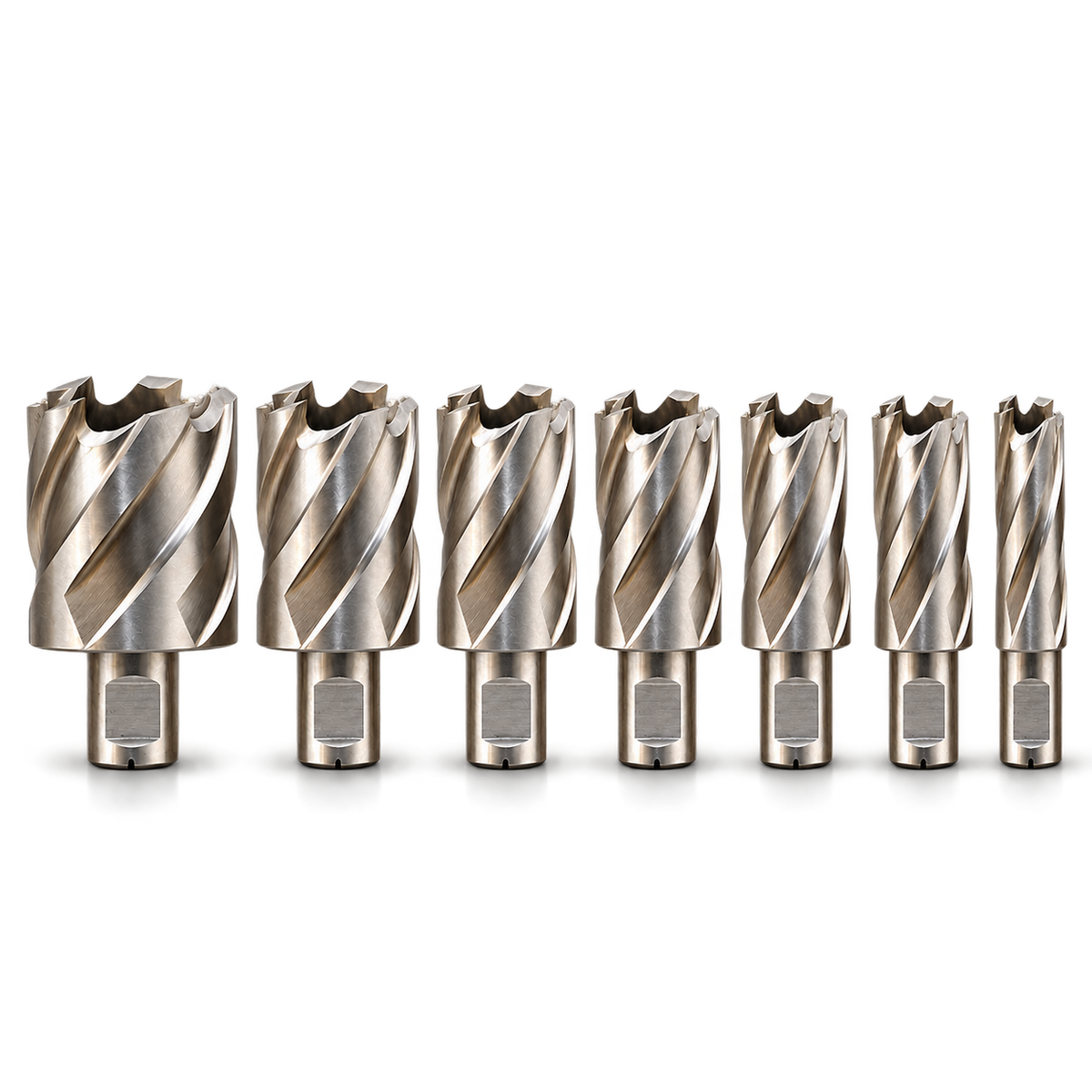 Seven Drillmate DMHB702 metric mini annular cutters, neatly aligned largest to smallest.