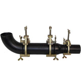 Sumner DX clamp application example showing three clamps aligning an elbow, straight pipe and reducer; clamps sold individually by size.