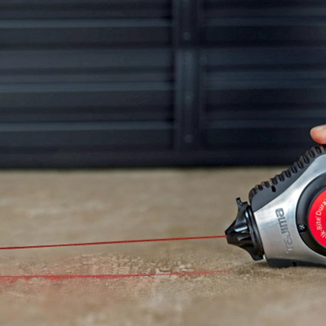 TAJIMA red micro chalk in use marking a red line on a surface with a chalk-line reel; reel not included