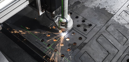 UNIMIG Stealth 3000 CNC table torch mount and sighting laser during plasma cutting; torch and steel shown in use