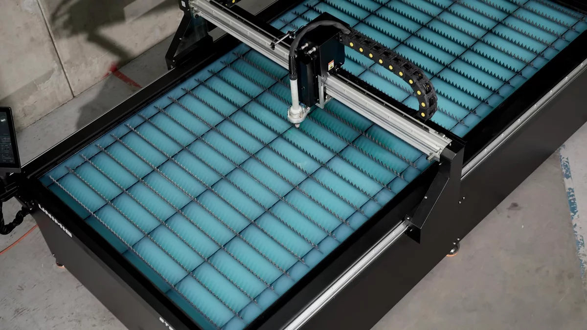 UNIMIG Stealth 3000 CNC plasma table overhead view of water bed, material slats and gantry
