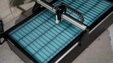 UNIMIG Stealth 3000 CNC plasma table overhead view of water bed, material slats and gantry